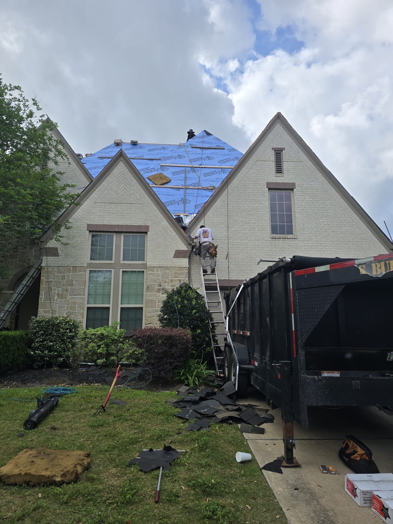 House roof covered with underlayment across the slopes before the shingles are laid.