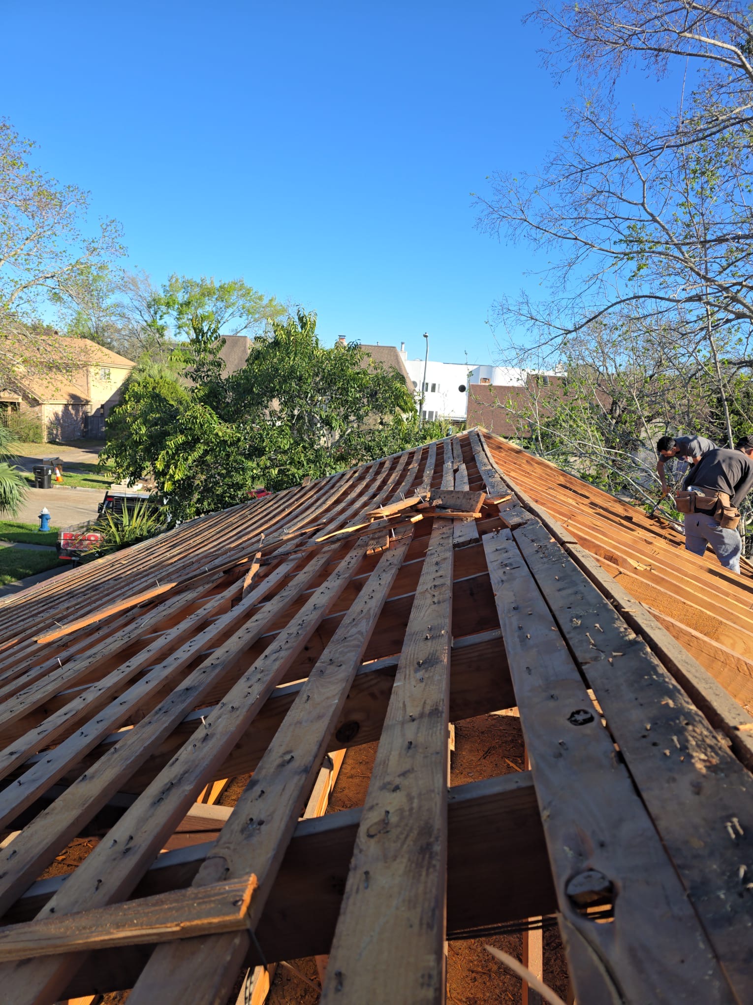Roof framing meeting at the ridge, with rafters running down each slope.